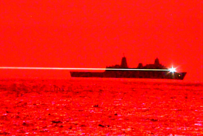 Red for danger: USS Portland fires its laser weapon at the UAV.