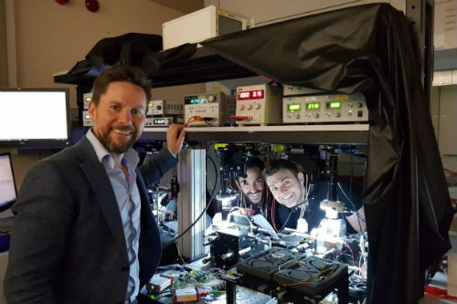 Researchers at QETLabs working on silicon quantum photonics. Click for info.