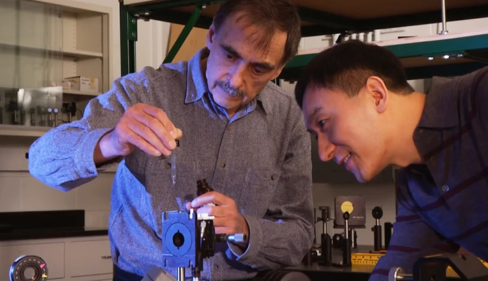 Professor Chunlei Guo (r) with Anatoliy Vorobyev, of Rochester's Institute of Optics.