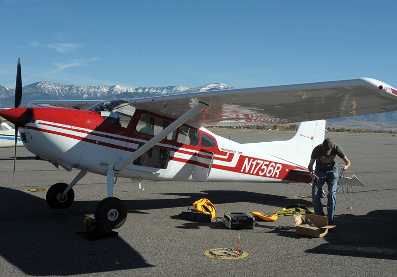 Right angle: setting up the LiDAR in the plane for a flight over Yellowstone Lake.
