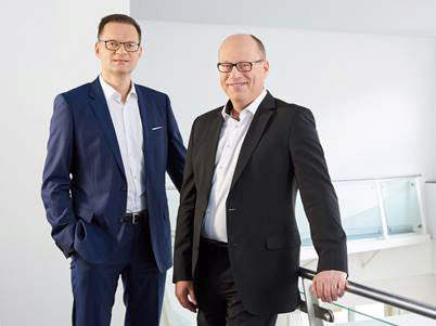 President & CEO Dr. Stefan Traeger and CFO Hans-Dieter Schumacher.