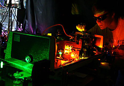 A student working with lasers in JILA's Nesbitt Lab.