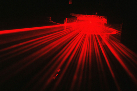 Red alert: Light scattering from a thin fibre particle illuminated by a laser beam.