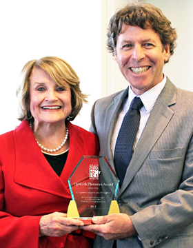 Louise Slaughter receives award from RRPC's Tom Battley.