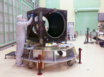 An engineer checks ICESat-2's box structure.