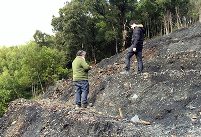 The coal truth: Two of the researchers fitting sensors in a spoil heap in Portugal.