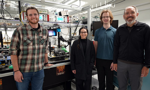 NIST researchers Grant Brodnik, Alexa Carollo, Lindell Williams and Scott Papp, among others, worked to make integrated circuits for light by depositing complex patterns of specialized materials onto silicon wafers. Credit:&nbsp;R. Jacobson/NIST.