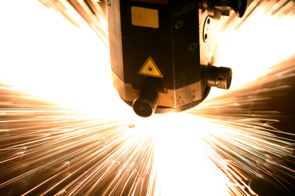 IPG Photonics dominates the market for industrial applications of high-power fiber lasers, such as metal processing in heavy industry. Credit: iStockphoto (laser type not specified).