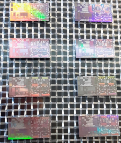These silicon photonic chips, developed at Ghent University and made at IMEC, are used inside the CARDIS-developed LDV equipment to collect and analyze laser signals reflected by a patient's skin. Photo: IMEC.