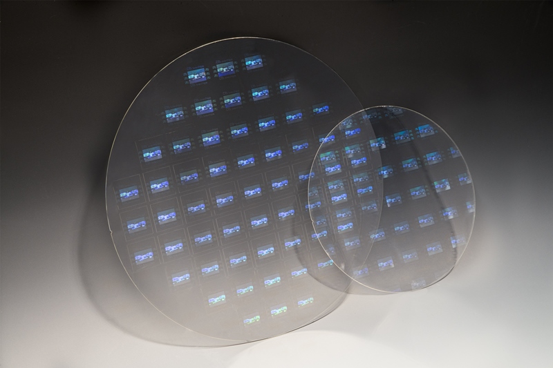 Schott's high-index glass wafers, shown here as a pair measuring 300mm and 200mm in diameter, are being patterned using a nanoimprint lithography method developed by the Austrian equipment firm EV Group. The companies say that the technology is now ready to be scaled up for the next generation of AR/VR/MR headsets. Photo: EV Group.