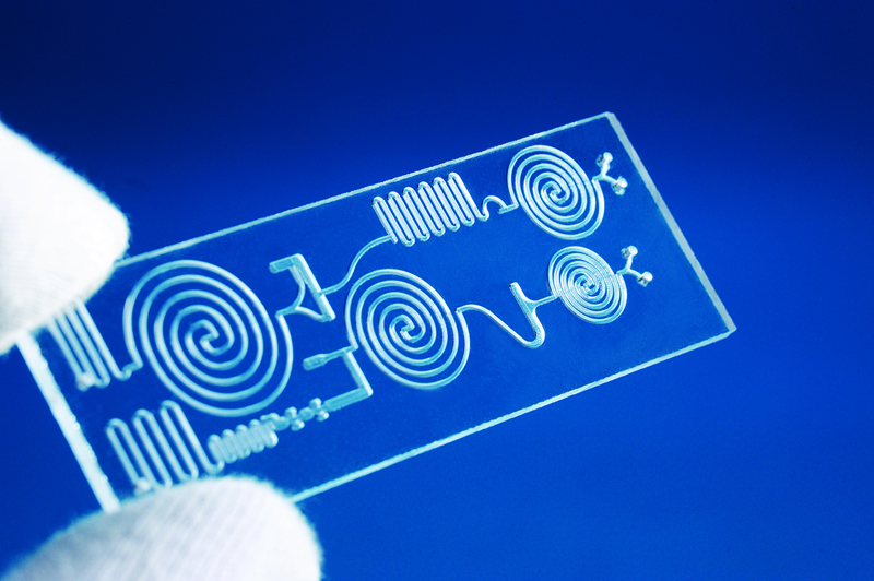 In the SeQuLas research project, the partners developed an electronically monitored process for gentle, high-precision laser transmission welding of small plastic components for medical technology (in the picture: microfluidic chip from Bartels Mikrotechnik). &copy; Fraunhofer ILT, Aachen, Germany.