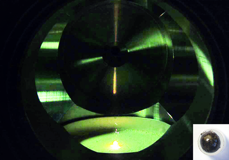 Melting moon dust into spheres under lunar conditions - enabled by the Einstein-Elevator of HITec. Inset: Laser-melted regolith formed into a sphere. Photos: LZH/LUH/IRAS - HITec.