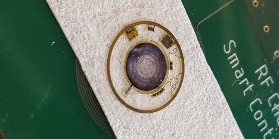 An artificial iris embedded in a smart contact lens could help treat several eye conditions. Credit: imec.