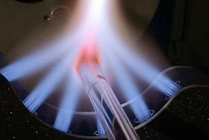 Fire in the hole: Hollowcore NANF fiber in manufacture. Image: Lumenisity.