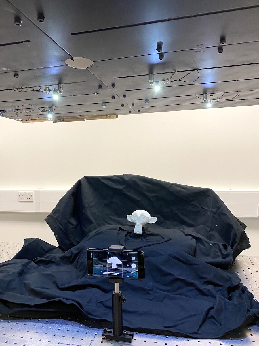 Researchers developed a way to use overhead LED lighting and a smartphone to create 3D images of a small figurine. Credit: Emma Le Francois/University of Strathclyde.