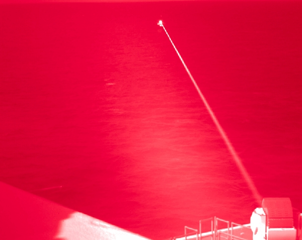 Amphibious transport dock ship USS Portland conducts a high-energy laser weapon system demonstration on a static surface training target, while sailing in the Gulf of Aden on December 14. The US Navy says that during the demonstration, the 