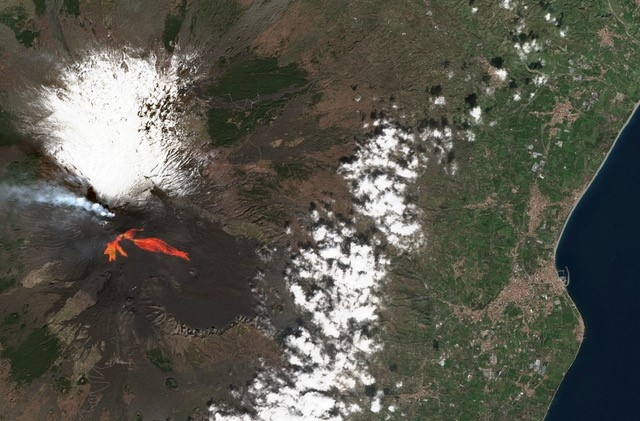 Imaged using a detector provided by Teledyne e2v, this red-green-blue composite photo from the ESA's Copernicus Sentinel-2 satellite shows lava flow from Mt Etna in red/orange, as well as the emitted plumes. The image was captured in February, when Europe's largest volcano resumed activity. Image: ESA.