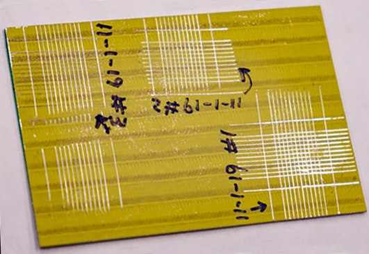A primer-coated specimen shows marks from the laser system. Credit: Carlos Jones/ORNL, U.S. Dept. of Energy.