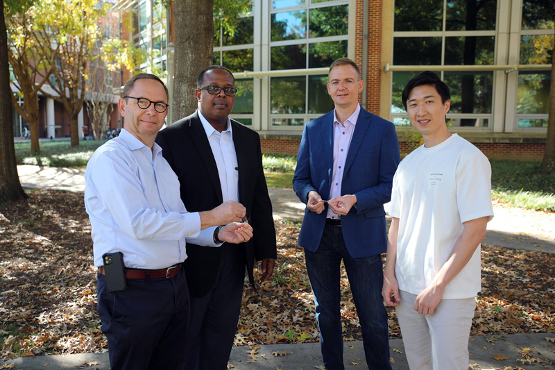 Three engineering labs at Georgia Tech collaborated to demonstrate a new level of stretchability of a photodetector. Pictured above is first author Youngrak Park (right) with the lab leads (L to R) Bernard Kippelen,  Samuel Graham, and Olivier Pierron. Photo credit: Ben Wright, Georgia Tech.