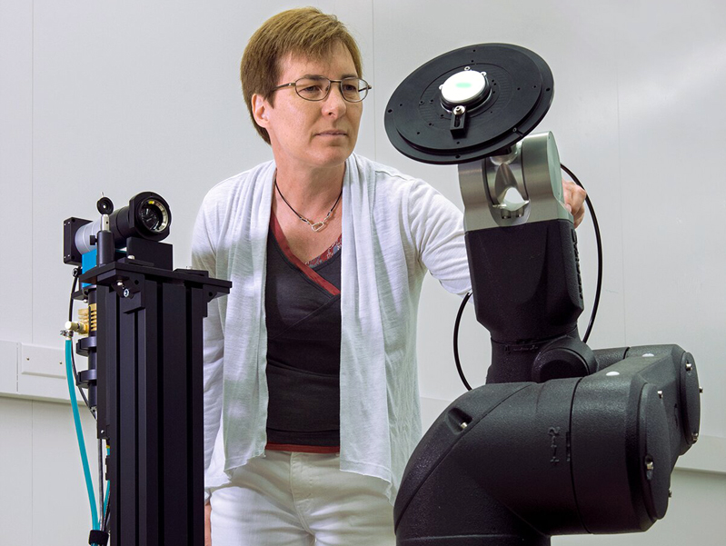 NIST physicist Heather Patrick with ROSI. Credit: Curt Suplee/NIST.