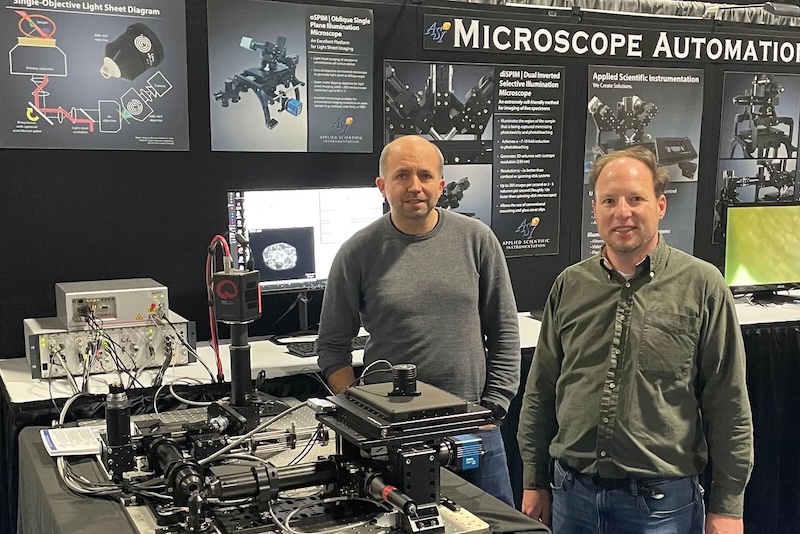 Jon Daniels of ASI and Florian Fahrbach of Leica Microsystems pictured at the Cell Bio 2022 launch of the open, customizable platform for single-objective light-sheet microscopy co-developed by ASI and Leica Microsystems. Credit: Leica.