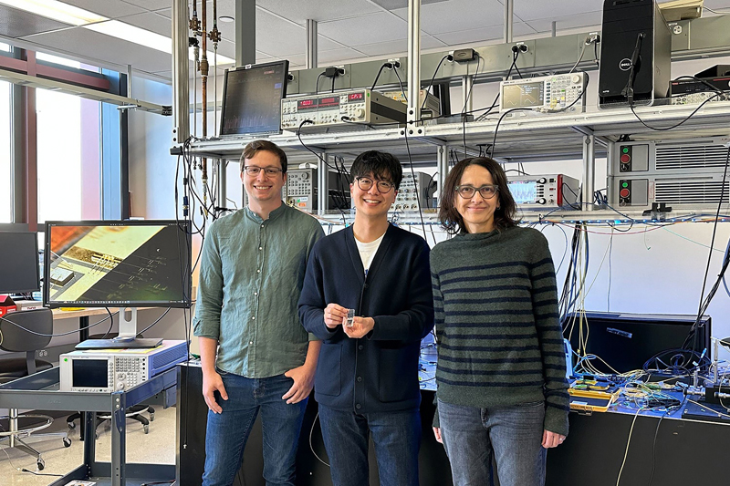 From left, Alexander White, Geun Ho Ahn, and Jelena Vu&ccaron;kovi&cacute; with the nanoscale isolator. Image credit: Hannah Kleidermacher.