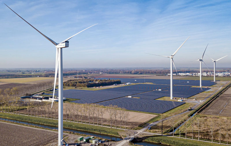 Even intermittent shading of solar panels by turbine baldes cuts efficiency. Energy park Haringvliet Zuid in The Netherlands is Vattenfall's first hybrid park. It consists of six wind turbines, 115,000 solar panels and 12 containers of batteries. Photo: Vattenfall/Jorrit Lousberg.