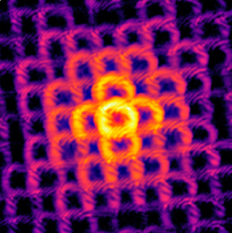 Doughnut-shaped beams of light scatter away from a tiny structure. Credit: Wang, et al., 2023, 