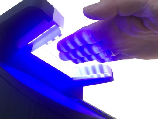 IDloop says that its contactless imaging system for capturing fingerprints is both faster and more hygienic than existing scanner systems, which require digits to be pressed onto a scanner window. Image: IDloop.