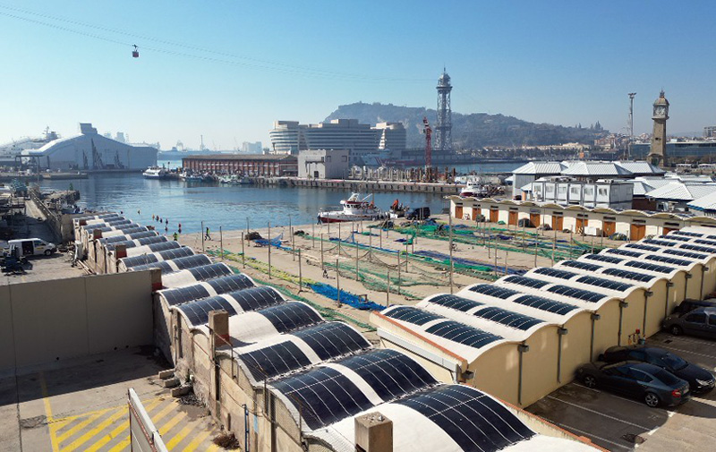 Barcelona port facilities with HeliaSol glued to undulating rooftops. Image: Heliatek.