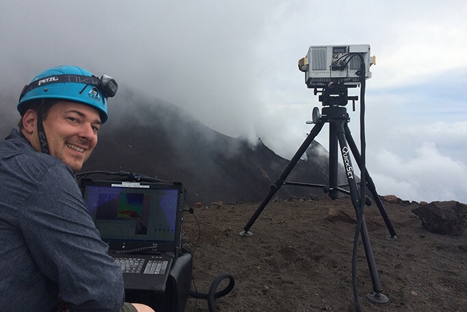 Telops field applications scientist Marc-Andr&eacute; Gagnon travelled with a team of French scientists from the Universit&eacute; Blaise Pascal to climb the Stromboli volcano, gathering hyperspectral thermal imaging data of its eruption with the Telops Hyper-Cam. Passive infrared hyperspectral imaging allows the detection and identification of multiple gases like sulfur dioxide and silicon fluoride (SiF<sustrong>4</sustrong>) escaping from craters and fumaroles, from a remote location, without the need for additional equipment. Photo: Telops.
