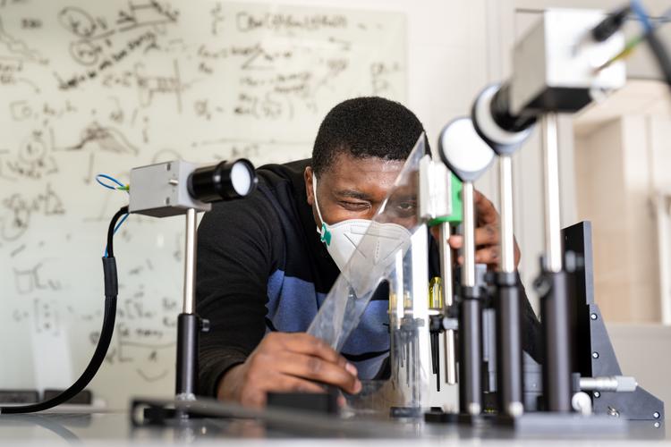 Princeton University doctoral student Atsutse Kludze conducts research in the lab of Yasaman Ghasempour, assistant professor in Electrical and Computer Engineering. Photo credit: Sameer Khan for Princeton University.