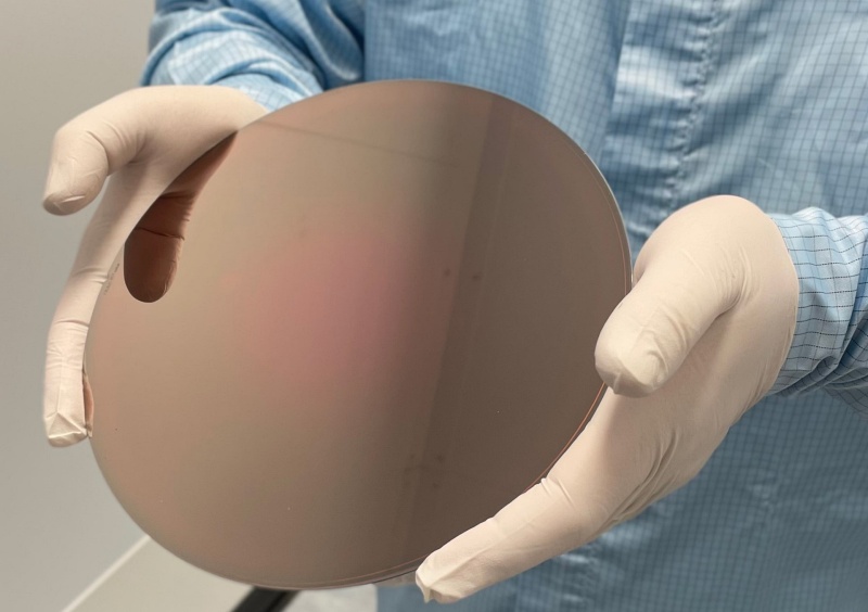 IQE's 200 mm-diameter RGB micro-LED epiwafer (shown here) promises to represent a key step towards mass production of the devices, which are tipped for success in AR/VR display applications - provided that costs can be reduced significantly. Production on 200 mm and 300 mm silicon wafers would be one of the key ways to reduce manufacturing costs. Startup Mojo Vision has now produced a 300 mm-diameter wafer hosting an array of blue micro-LEDs. Photo: IQE.