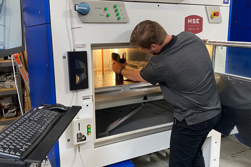 A high-speed 3D printing system from Essentium. This system was used to produce biocompatible prosthetic devices - the Texas-based company is now partnering with blue laser developer Nuburu to deliver a 3D printing solution for producing metal parts. Photo: Essentium. 