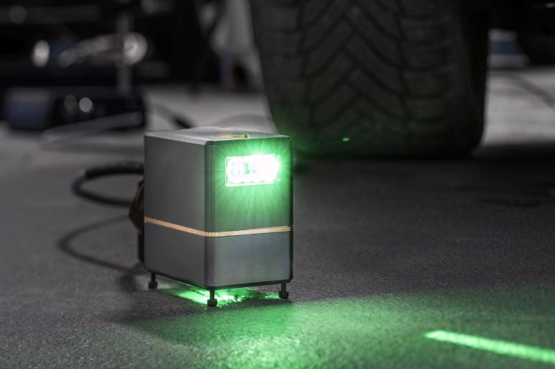 Measuring 7 x 7 x 5 cm, the projector can be integrated into any car sill and cover a projection area of 100 x 30 cm. &copy; Fraunhofer IOF.