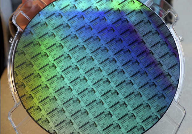 Image of a silicon photonics wafer manufactured by AIM Photonics with demonstrator circuits for critical defense technology applications such as datacom and lidar. Photo: AIM Photonics.