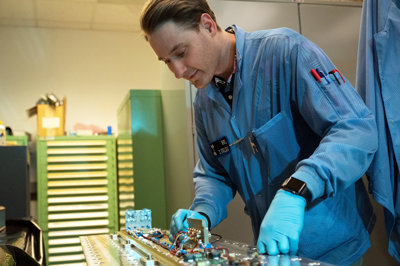 Zachary Kaldy, U.S. Naval Research Laboratory thermal engineer, inspects the Space Wireless Energy Laser Link (SWELL) in Washington, D.C. SWELL will launch aboard the DoD Space Test Program-H9 payload (STP-H9) to the International Space Station in 2023, where it will then be powered on and operate for one to two years. SWELL will be the first on-orbit demonstrations of Laser Power Beaming. U.S. Navy photo by Jonathan Sunderman.