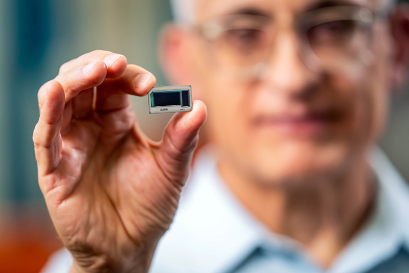 Hamid Azimi, corporate vice president and director of substrate technology development at Intel Corporation, holds an Intel assembled glass substrate test chip at Intel's Assembly and Test Technology Development factories in Chandler, Arizona, in July 2023. Intel's advanced packaging technologies come to life at the company's Assembly and Test Technology Development factories. Credit: Intel.