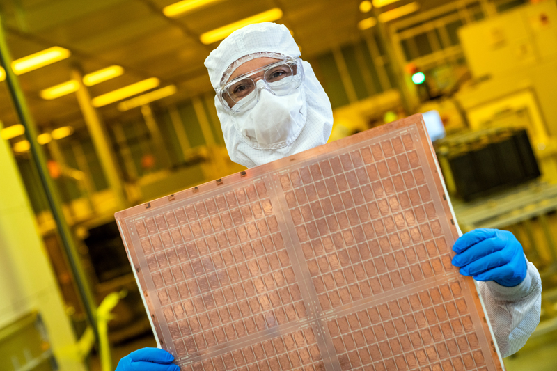 An Intel engineer holds a test glass core substrate panel at Intel's Assembly and Test Technology Development factories in Chandler, Arizona, in July 2023. Intel's advanced packaging technologies come to life at the company's Assembly and Test Technology Development factories. Credit: Intel.