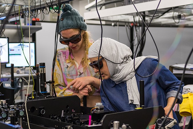 Doctoral students working in The University of Manchester's Photon Science Institute lab. Photo: University of Manchester.