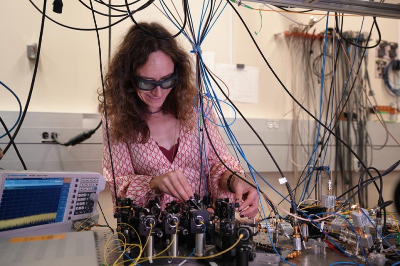 Esther Baumann works in the lab where a team of researchers has developed an improved version of a laser-based measurement technique called dual-comb spectroscopy. Credit: R.Jacobson / NIST.