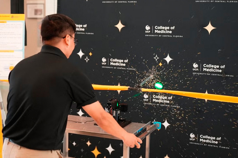 Opening ceremony included a laser ribbon cutting by Prof. Guifang Li,from the College of Optics and Photonics. Photo: CREOL / UCF.