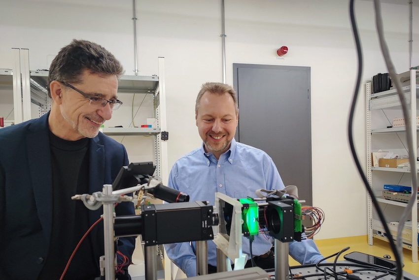Andreas Waag (TU Braunschweig) and Christian Werner (Ostfalia) at the demonstrator for an LED-based neuromorphic computer. Credit: Laurenz K&ouml;tter/TU Braunschweig.
