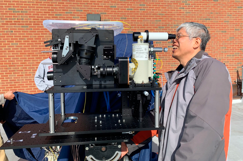 Engineer Jeffrey Chen tests a CASALS lidar prototype on the roof of Goddard's Building 33. Photo: NASA