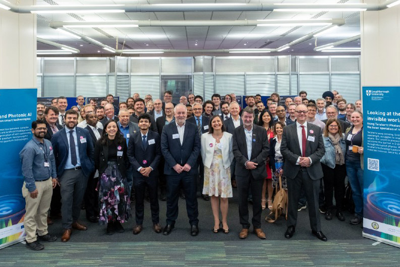 Academics and esteemed guests celebrating the Emergent Photonics Research Centre at the opening event. 