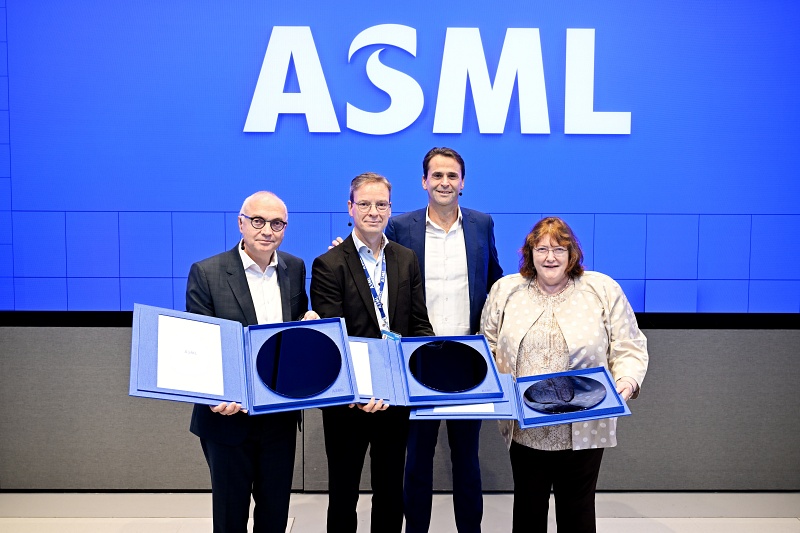 The high-NA era begins (l-r): imec CEO Luc Van den hove; ASML's Peter Vanoppen and new CEO Cristophe Fouquet, and Intel's Ann Kelleher, holding the very first 300mm-diameter silicon wafers exposed at the new high-NA EUV lithography lab. Photo: ASML/imec.