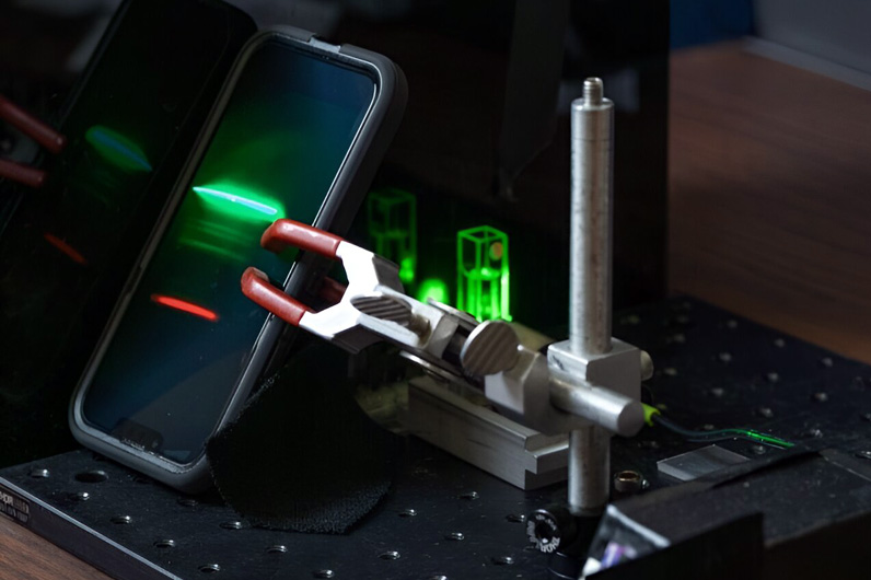 Smartphone records the Raman spectrum of a target substance (an ethanol solution, in this case) for further analysis. Credit: Texas A&M University Engineering.