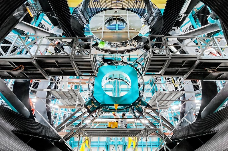 On July 24, 2024, Vera C. Rubin Observatory's 3.5-meter secondary mirror was installed onto the Simonyi Survey Telescope. The installation was successfully completed after installing the mirror onto its support cell and moving the combined structure from Rubin's maintenance floor up to the dome level via the heavy-load platform lift. The secondary mirror is the first piece of glass to be installed into its final position on the telescope. Credit: Rubin Observatory/NSF/AURA/F. Munoz Arancibia.