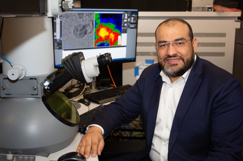 Mohammed Hassan, associate professor of physics and optical sciences, let a group of researchers in developing the first transmission electron microscope powerful enough to capture images of electrons in motion. Photo courtesy of Amee Hennig.