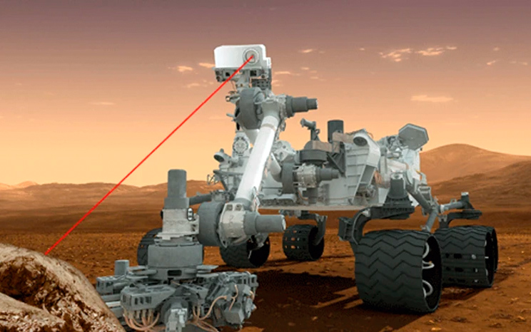 NASA's Mars rover Curiosity fires its mast-mounted ChemCam laser at a rock target in this artist's illustration. The laser has fired more than 100,000 shots on Mars.NASA / JPL-Caltech.